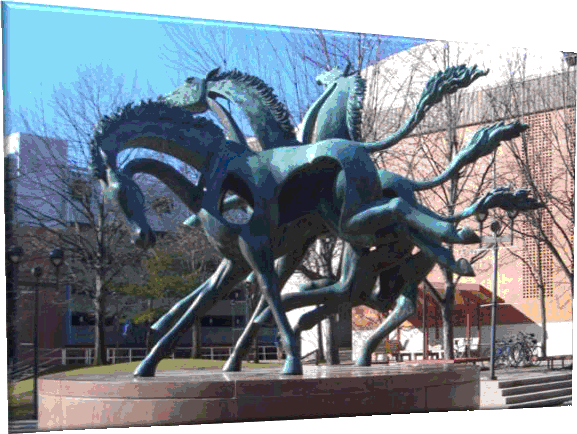 Sculpture of wild horses pulling in different directions at Drexel University